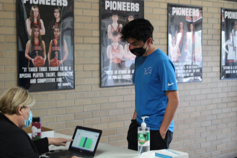 Freshman track runner Adam Elsersy checks in for his weekly COVID-19 test on May 2, 2021. It has yet to be determined if the weekly testing schedule will be impacted by Governor Gretchen Whitmer’s announcement on May 14, 2021 to waive the mask mandate for fully vaccinated individuals for both indoor and outdoor activities. 