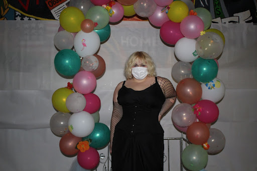 Sophomore Averie Hughes posing at the balloon arbor in the cafeteria at the homecoming dance on Oct. 9, 2021. Hughes said that she was at first intimidated by the dance but ended up enjoying herself. “It was my first time going to a school dance, and since were still struggling with covid, I was nervous,” Hughes said. “I ended up having a lot of fun with my friends dancing and hanging out outside.”