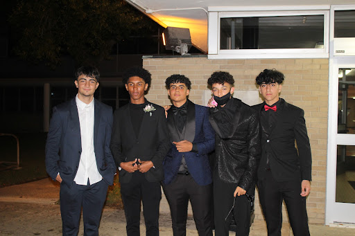 Sophomores Mohamed Saab, Amwah Ali, Hadi Saab, Kyle Singleton, and Malik Toumi pictured after the homecoming dance outside the DHS main door on Oct. 9, 2021. Ali said that he was surprised by how the night went. “The night turned out way better than anyone thought it would,” Ali said. “I wouldn’t have changed a thing.”