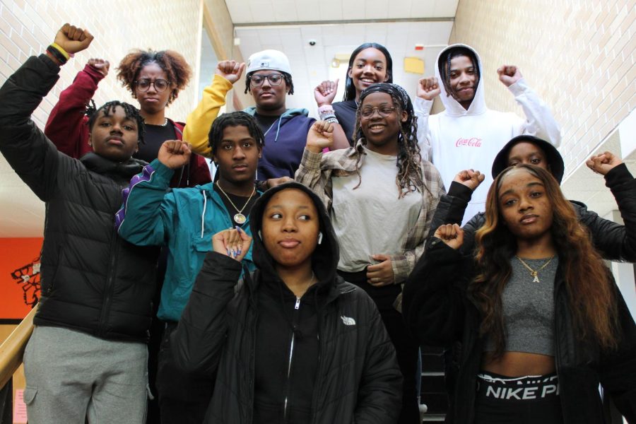 The+members+of+Deasrborn+High+Schools+Black+Student+Union+stand+in+the+hallway+in+solidarity.+The+club+was+founded+in+December+2022.