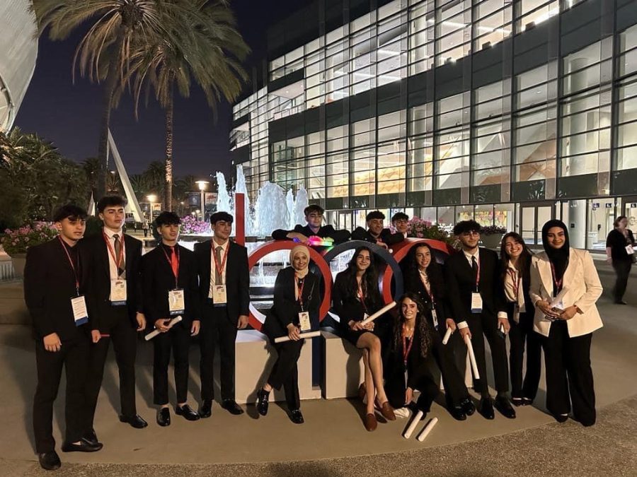 Dearborn High School’s BPA members stand outside the BPA National Leadership Conference
in Anaheim California. Members were able to sightsee after the conference was concluded.“We
went to Disneyland, we hiked and saw the Hollywood sign, and we went to the beach,” DHS
Senior and BPA president Adam Fakhoury said.