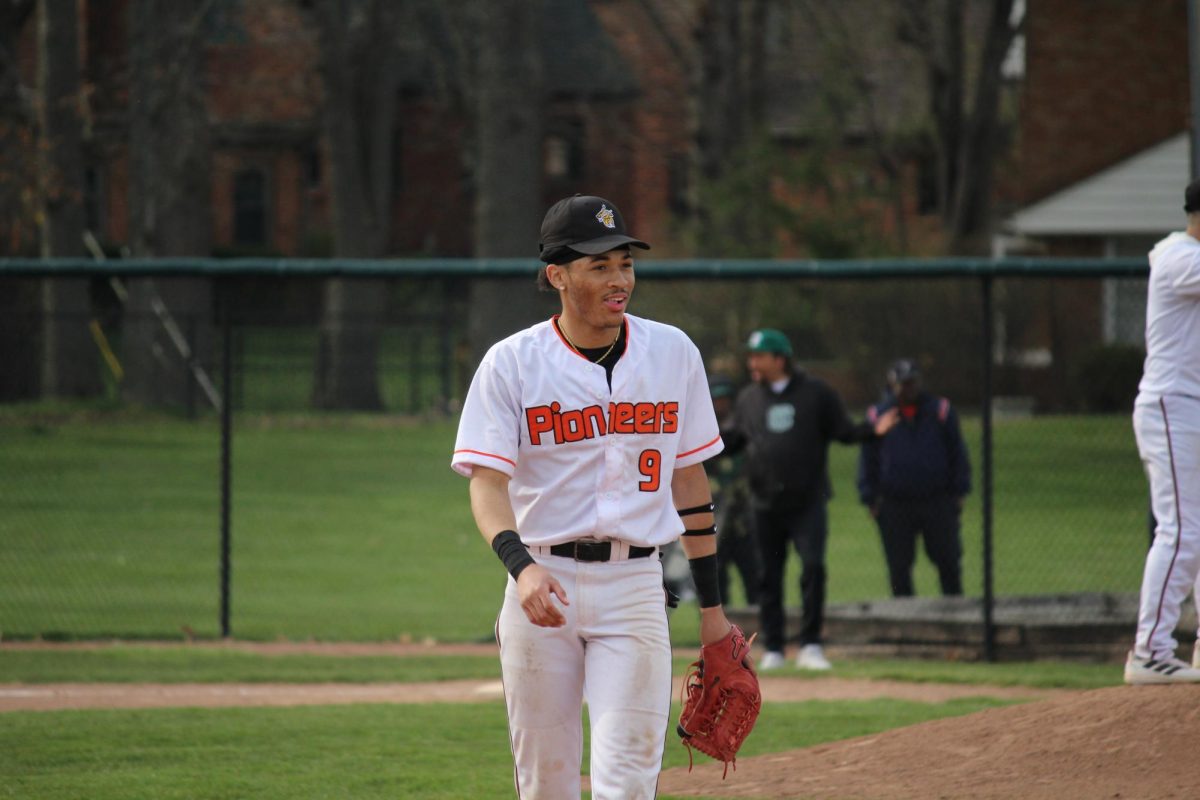 On April 17, 2025, during their home game against Cass Tech, DHS Varisty baseball
player, Glenn Scurlock, is playing third base and looks to his teammates as they finish the play. “He has that next pitch mentality, he wipes it off, and he gets that bat the next one,” Lansang said. DHS ended up winning their game, against Cass Tech, 9-8.