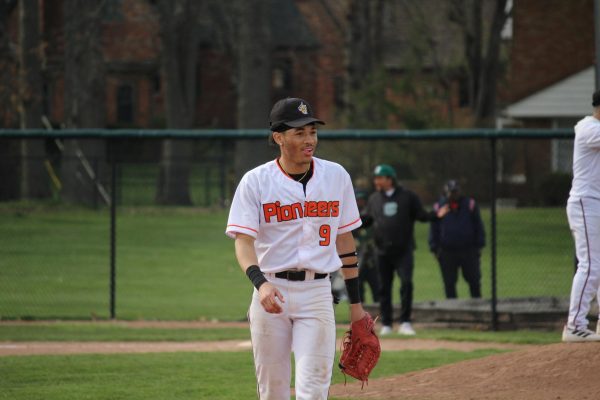 On April 17, 2025, during their home game against Cass Tech, DHS Varisty baseball
player, Glenn Scurlock, is playing third base and looks to his teammates as they finish the play. “He has that next pitch mentality, he wipes it off, and he gets that bat the next one,” Lansang said. DHS ended up winning their game, against Cass Tech, 9-8.